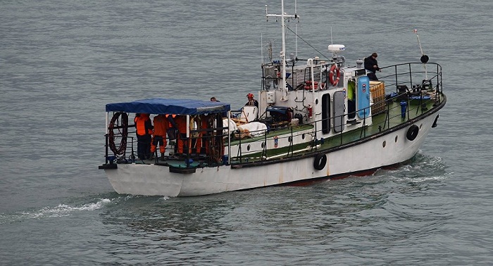 Russian emergencies ministry says expands Tu-154 search operation area 